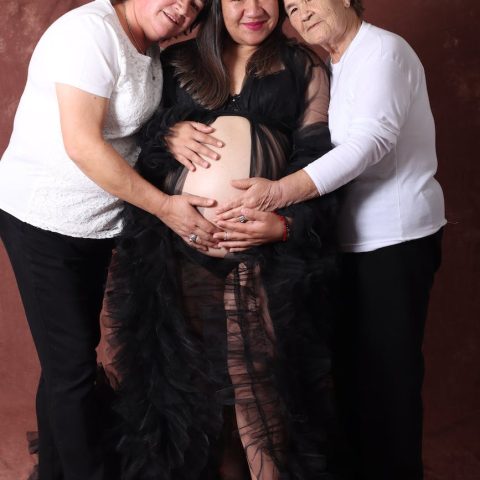 family portrait of a pregnant woman with her mother and grandmother