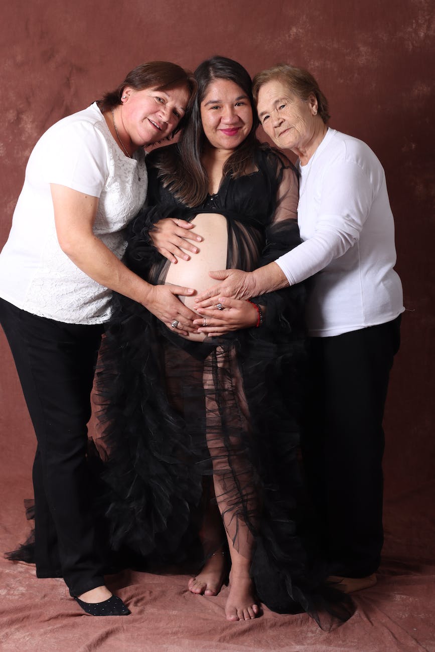 family portrait of a pregnant woman with her mother and grandmother