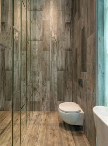 modern and minimalistic bathroom with wooden panels on walls