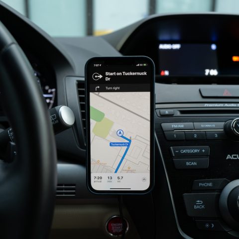 black android smartphone on car center console