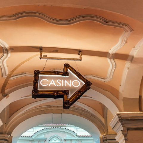 a casino sign hanging from the ceiling of a building