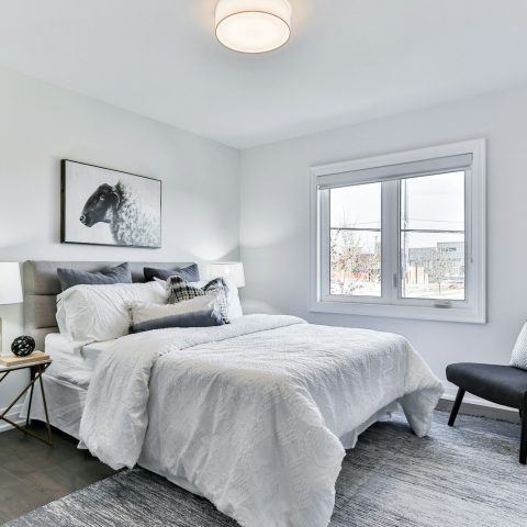 white bed linen on bed