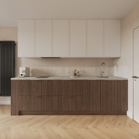 A large kitchen with a wooden floor and white cabinets